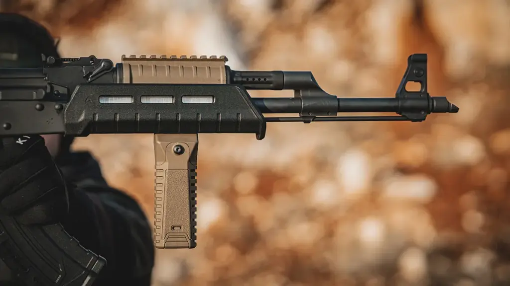 FDE M-LOK accessories and top rail installed on an AK rifle