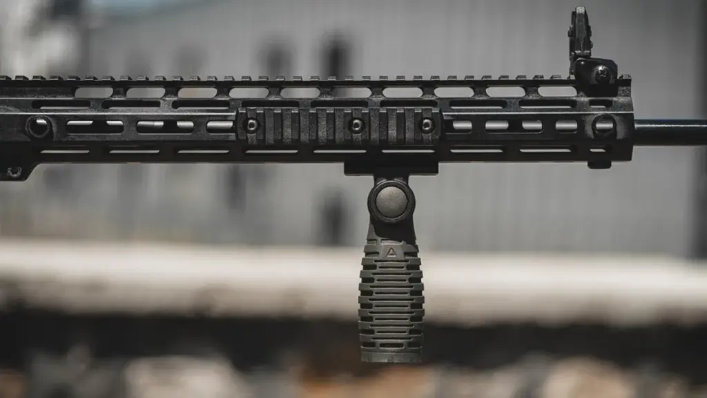 M-LOK compatible rail section and folding foregrip on an AR-15 handguard