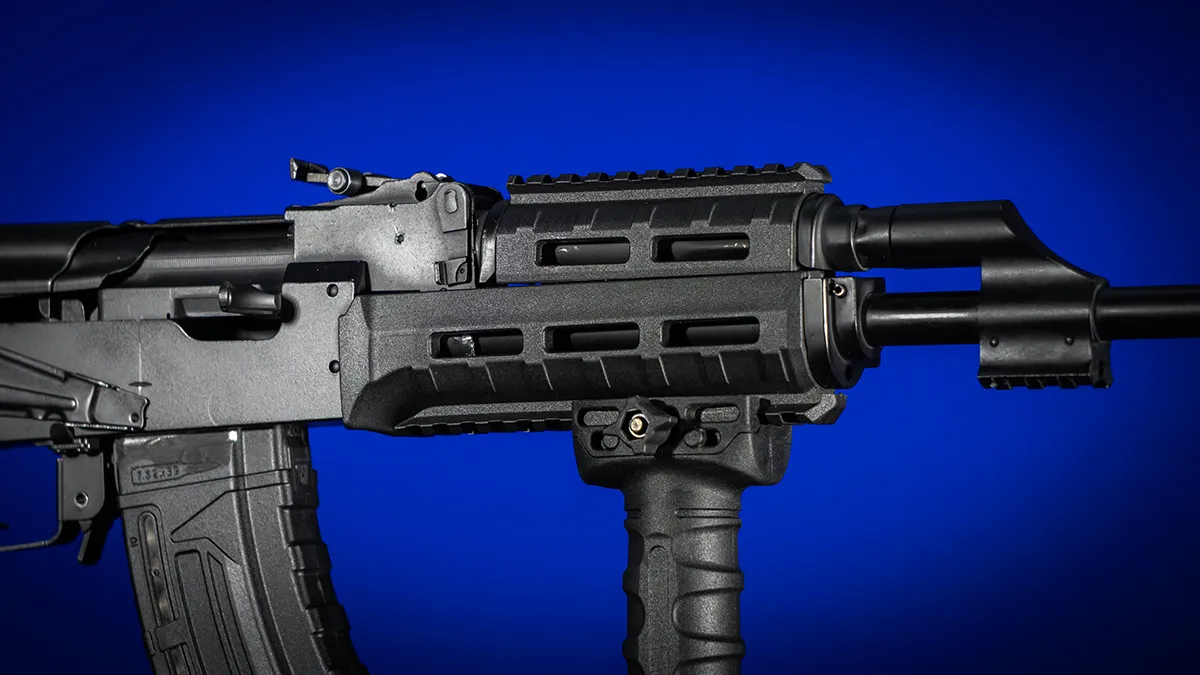 AK platform rifle fitted with an M-LOK handguard and vertical foregrip