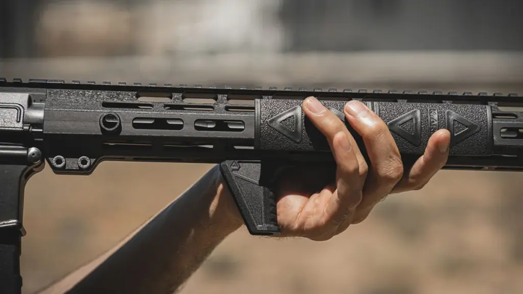 Support hand on an M-LOK handguard with a handstop installed